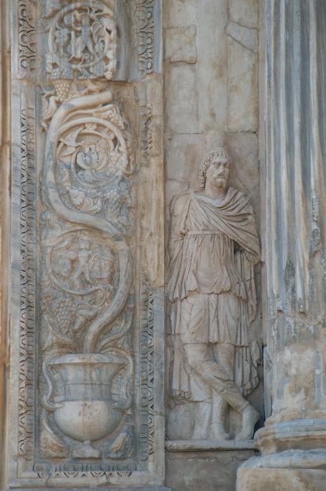 Lepcis, Arch of Septimius Severus, SW, barbarian (left)