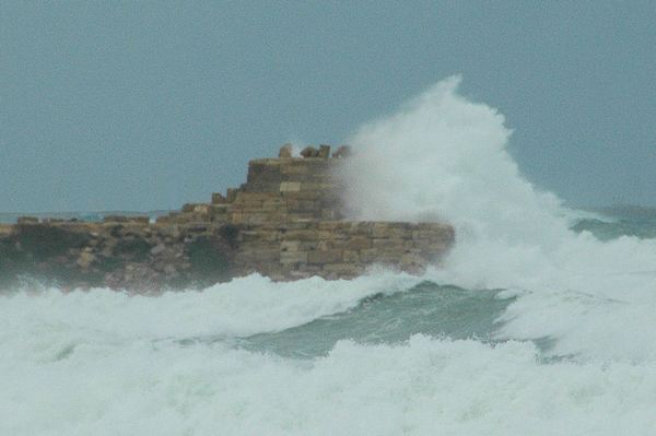 Lepcis Magna, Port, ruins of the lighthouse in a storm