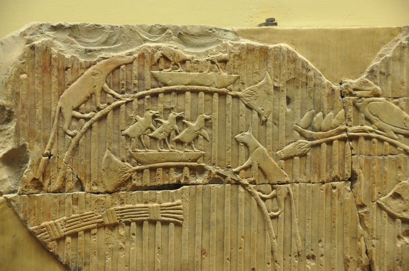 Relief of cats chasing birds
