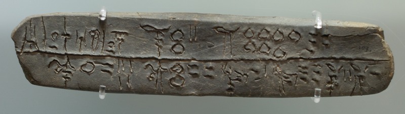 Linear-B tablet mentioning sheep, goats, oxen, and pigs being brought to a place called Si-ra-ro.