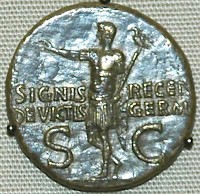 Germanicus returns with the recovered legionary standard (coin by his son Caligula)