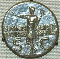 Germanicus returns with the recovered legionary standard (coin by his son Caligula)