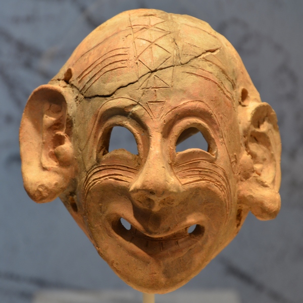 Carthaginian mask, smiling