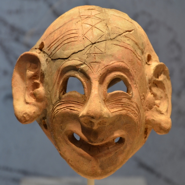 Carthaginian mask, smiling
