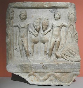 A relief showing the Dioscuri and the river god (to the right; only his legs are visible)