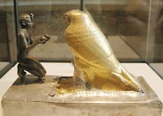 Taharqo venerating the falcon-god Hemen