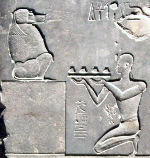 Psammetichus II sacrificing to Thoth, represented as baboon