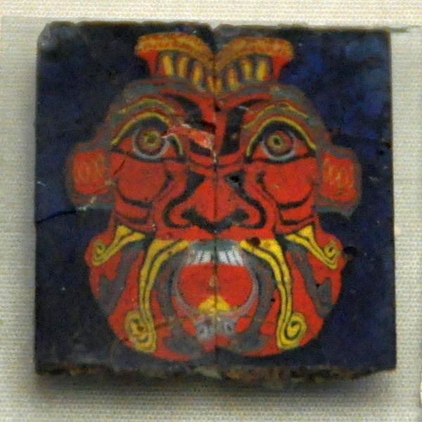 Glass mosaic of a face of Bes
